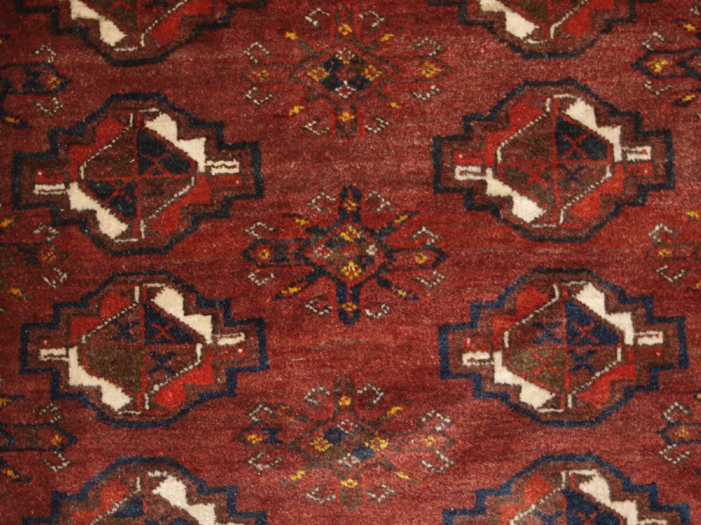 OLD AFGHAN VILLAGE CARPET, ERSARI WEAVERS, CHUVAL GUL DESIGN, CIRCA 1920. View VII