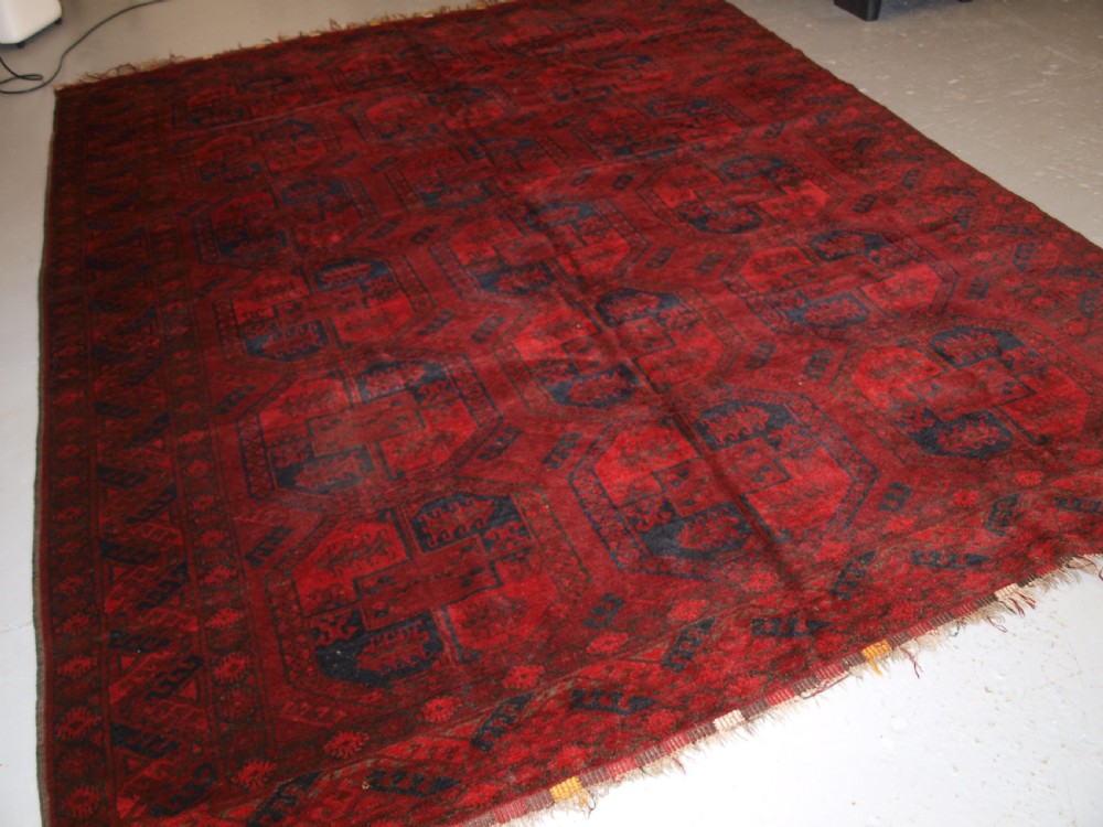 OLD AFGHAN VILLAGE CARPET, VERY DEEP RED COLOUR, TRADITIONAL DESIGN, CIRCA 1920.