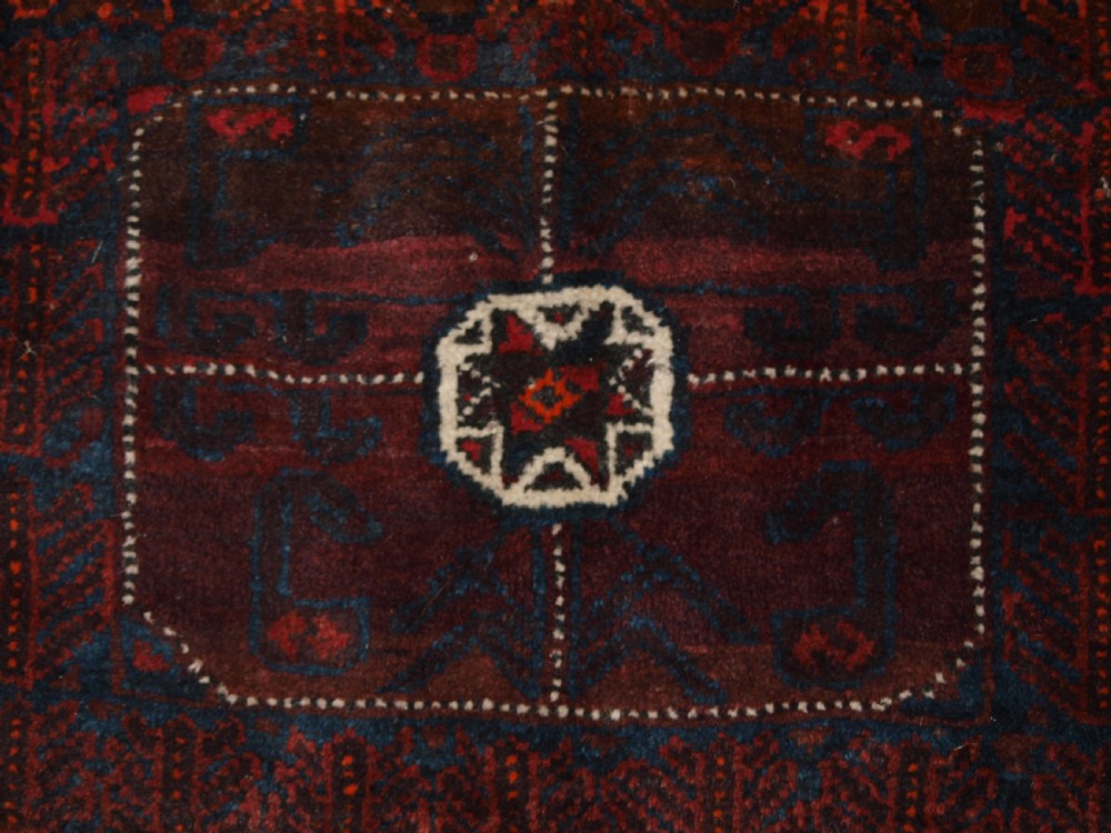 ANTIQUE AFGHAN BALUCH SADDLE BAG WITH PLAIN WEAVE BACK, CIRCA 1900. View II