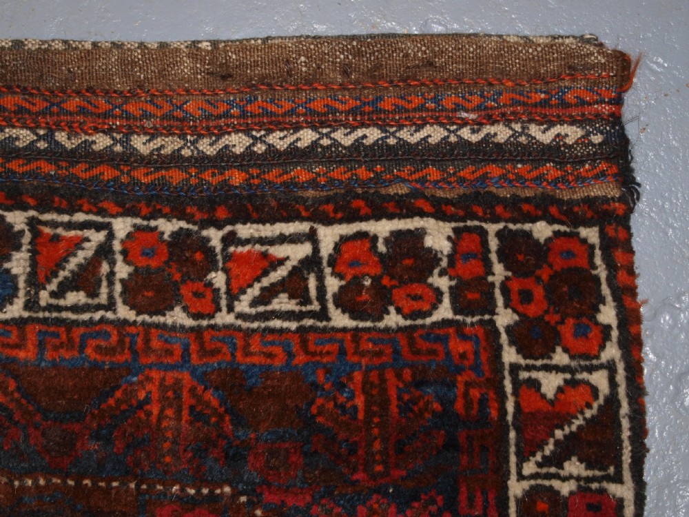 ANTIQUE AFGHAN BALUCH SADDLE BAG WITH PLAIN WEAVE BACK, CIRCA 1900. View IV