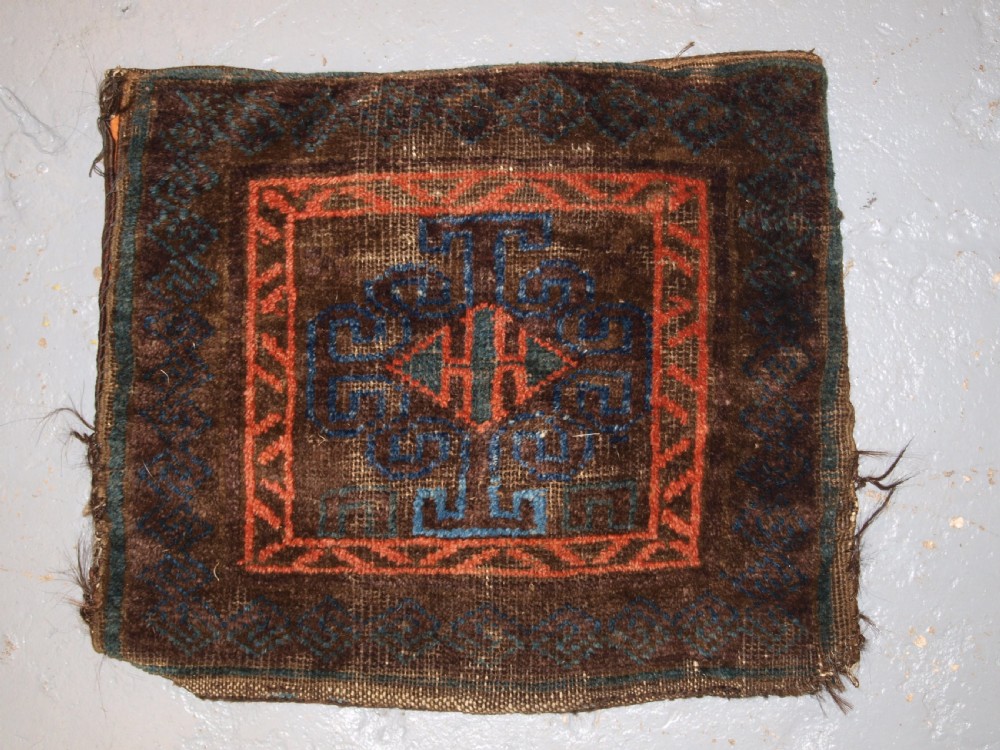 ANTIQUE AFGHAN BALUCH SADDLE BAG, GOOD COLOURS, PLAIN WEAVE BACK, CIRCA 1900.