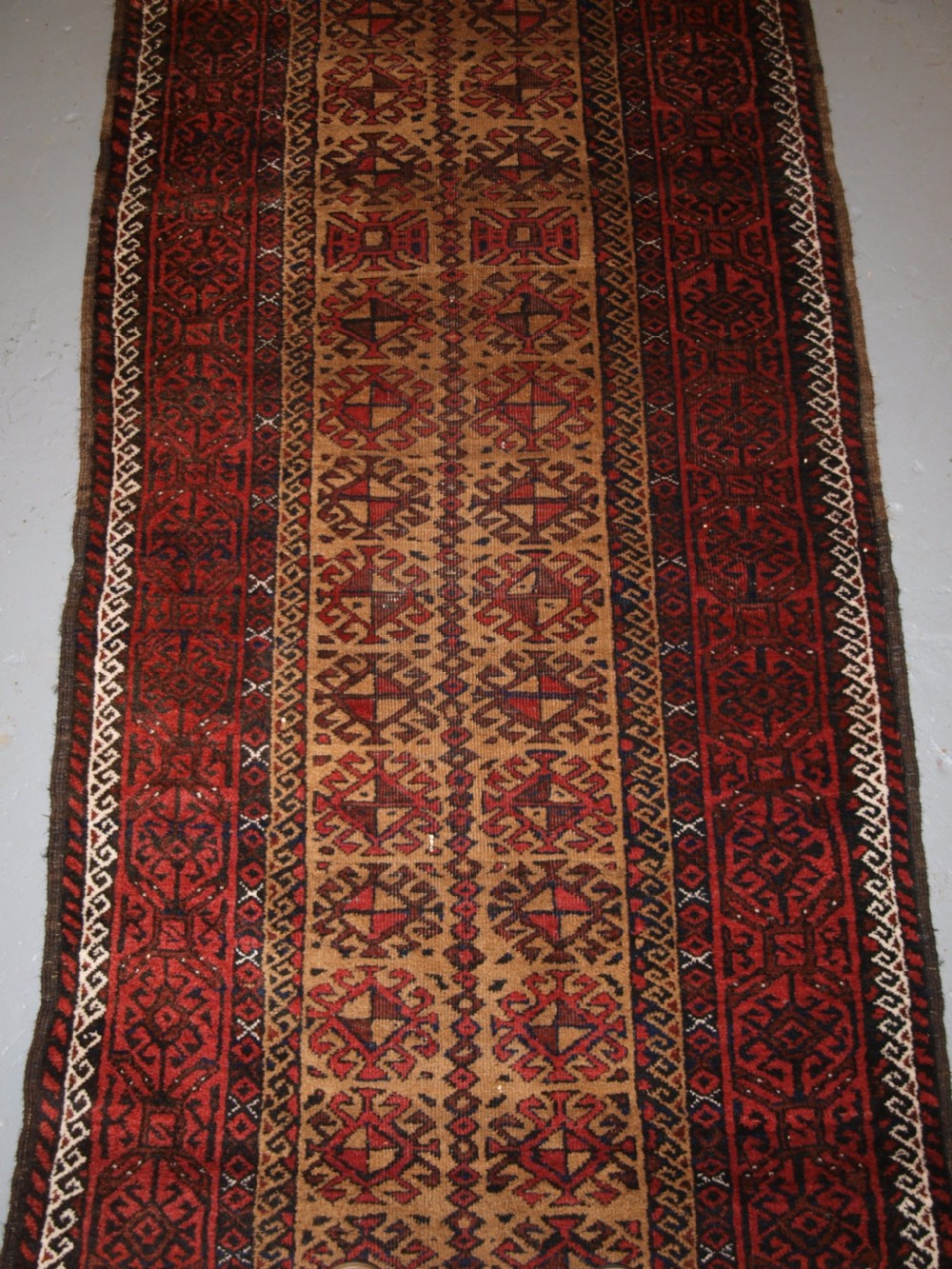 ANTIQUE BALUCH RUNNER, CAMEL GROUND WITH BIRDS AT EACH END. CIRCA 1900. View III