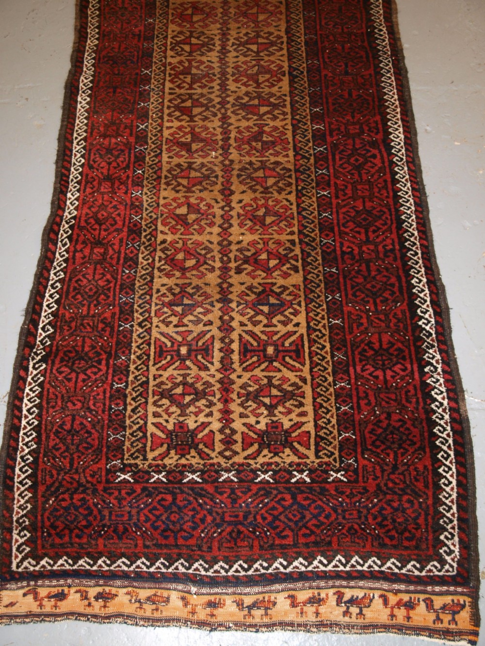 ANTIQUE BALUCH RUNNER, CAMEL GROUND WITH BIRDS AT EACH END. CIRCA 1900. View IV
