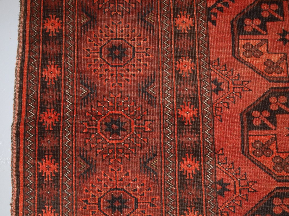OLD AFGHAN VILLAGE CARPET OF TRADITIONAL DESIGN, SOFT BURNT ORANGE COLOUR, CIRCA 1920. View IV