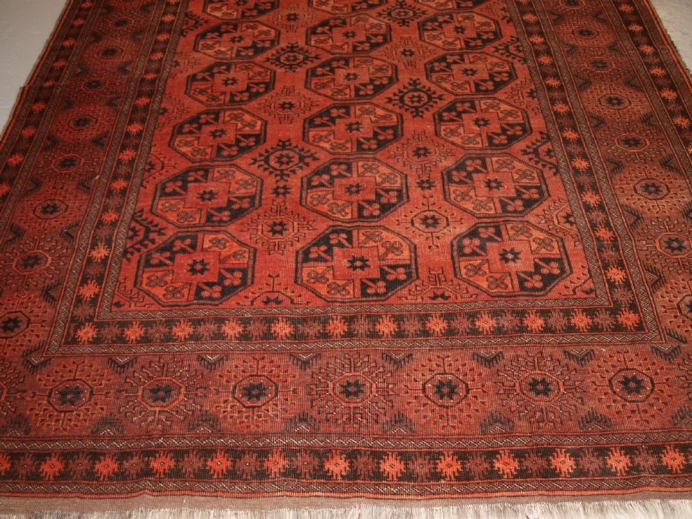 OLD AFGHAN VILLAGE CARPET OF TRADITIONAL DESIGN, SOFT BURNT ORANGE COLOUR, CIRCA 1920. View VI