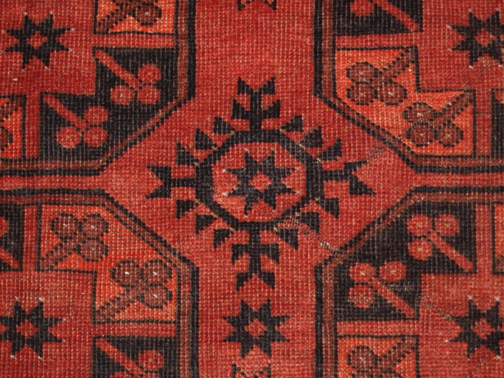 OLD AFGHAN VILLAGE CARPET OF TRADITIONAL DESIGN, SOFT BURNT ORANGE COLOUR, CIRCA 1920. View IX