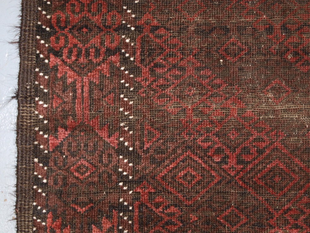 ANTIQUE AFGHAN BALUCH RUG, HEAVY WEAR, GOOD LIVED WITH LOOK, CIRCA 1900. View III