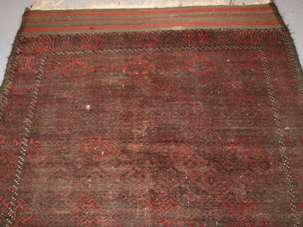 ANTIQUE AFGHAN BALUCH RUG, HEAVY WEAR, GOOD LIVED WITH LOOK, CIRCA 1900. View IV