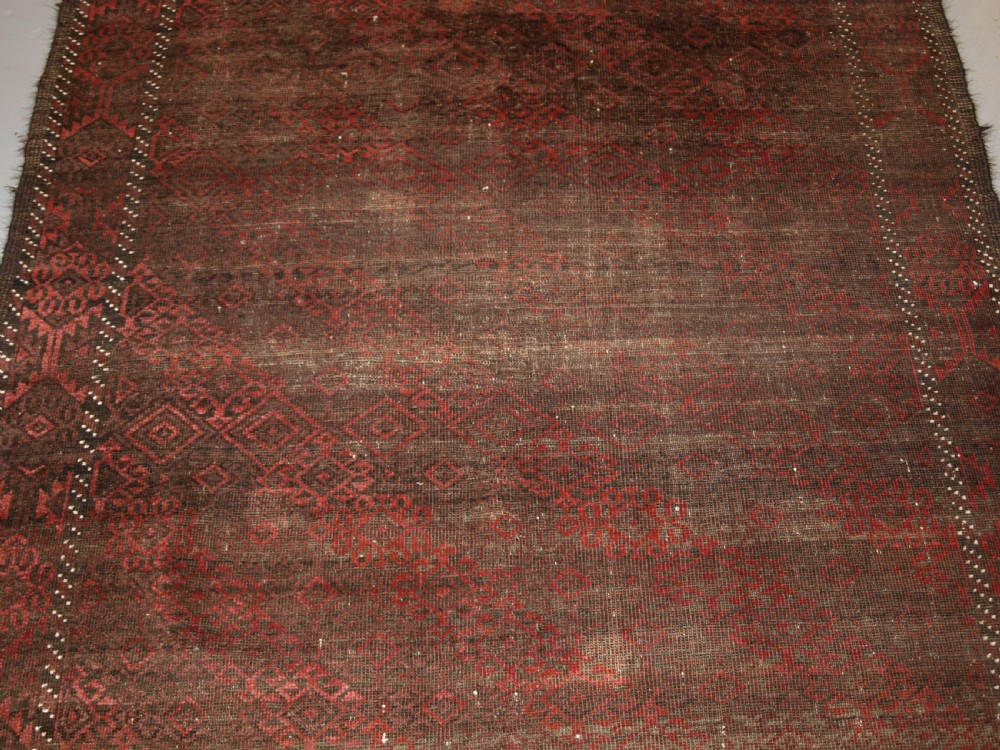 ANTIQUE AFGHAN BALUCH RUG, HEAVY WEAR, GOOD LIVED WITH LOOK, CIRCA 1900. View V