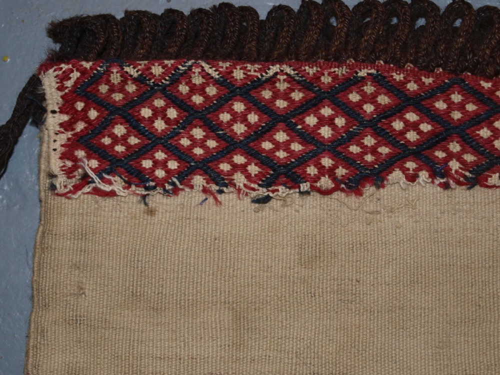 ANTIQUE TEKKE TURKMEN SADDLE BAG IN BANDED MIXED TECHNIQUE, PLAIN WEAVE BACK, CIRCA 1900/20. View VIII
