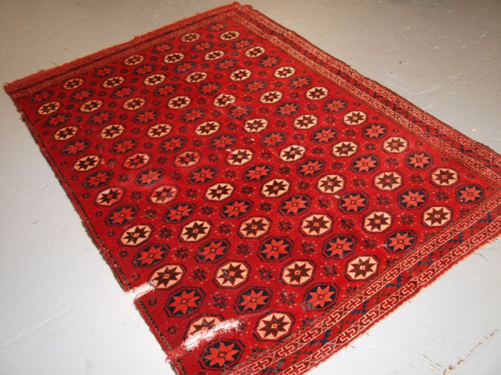 ANTIQUE ERSARI TURKMEN MAIN CARPET FRAGMENT, UNUSUAL STAR DESIGN, 2ND HALF 19TH CENTURY. View III