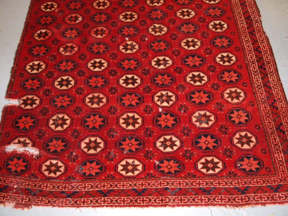 ANTIQUE ERSARI TURKMEN MAIN CARPET FRAGMENT, UNUSUAL STAR DESIGN, 2ND HALF 19TH CENTURY. View VI