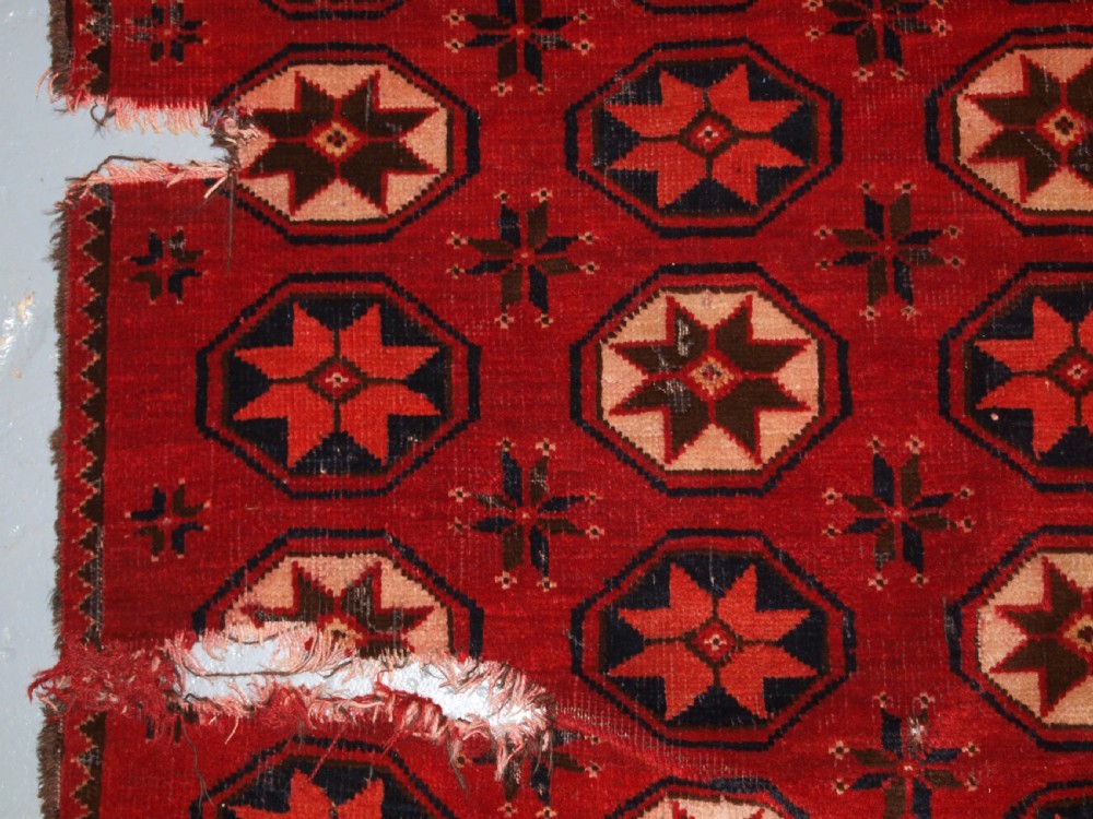 ANTIQUE ERSARI TURKMEN MAIN CARPET FRAGMENT, UNUSUAL STAR DESIGN, 2ND HALF 19TH CENTURY. View XIII
