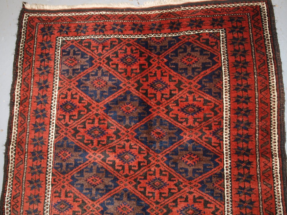 ANTIQUE BALUCH RUG WITH LATTICE DESIGN, STAR BORDER, CIRCA 1900. View II