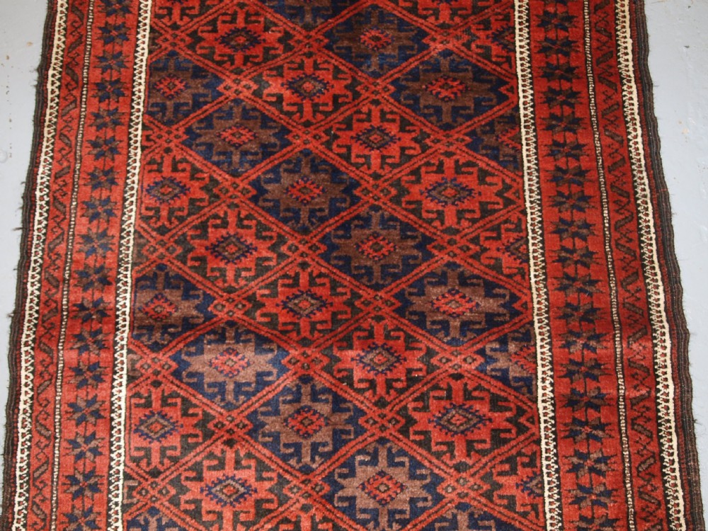 ANTIQUE BALUCH RUG WITH LATTICE DESIGN, STAR BORDER, CIRCA 1900. View III