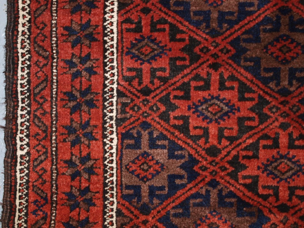 ANTIQUE BALUCH RUG WITH LATTICE DESIGN, STAR BORDER, CIRCA 1900. View VI