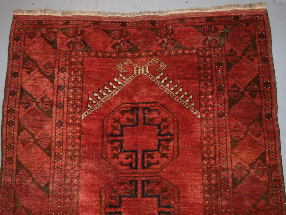 OLD AFGHAN VILLAGE PRAYER RUG WITH TURKMEN DESIGN, RAMS HORN MIHRAB, CIRCA 1920. View II