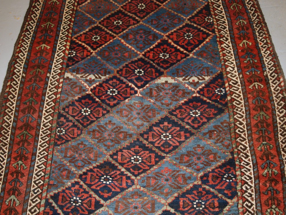 ANTIQUE KORDI RUG, KURDS OF KHORASSAN, LIGHT BLUE GROUND, CIRCA 1900. View IV