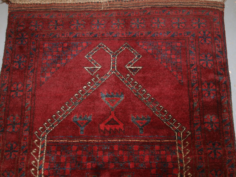 AFGHAN VILLAGE PRAYER RUG WITH RAMS HORN MIHRAB, CIRCA 1920. View II