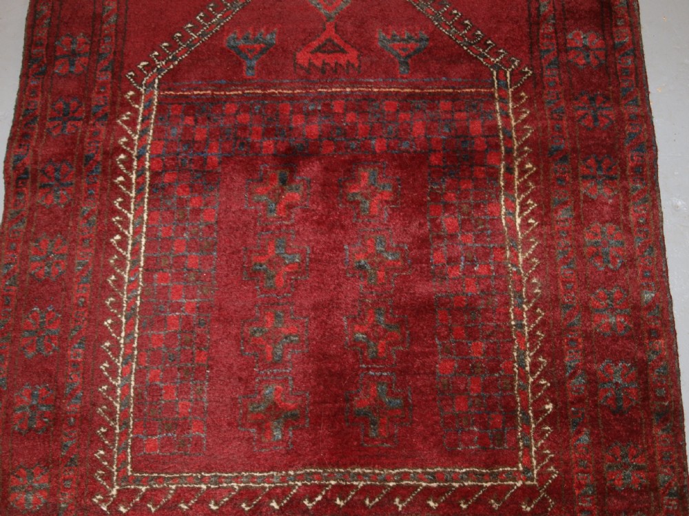 AFGHAN VILLAGE PRAYER RUG WITH RAMS HORN MIHRAB, CIRCA 1920. View III