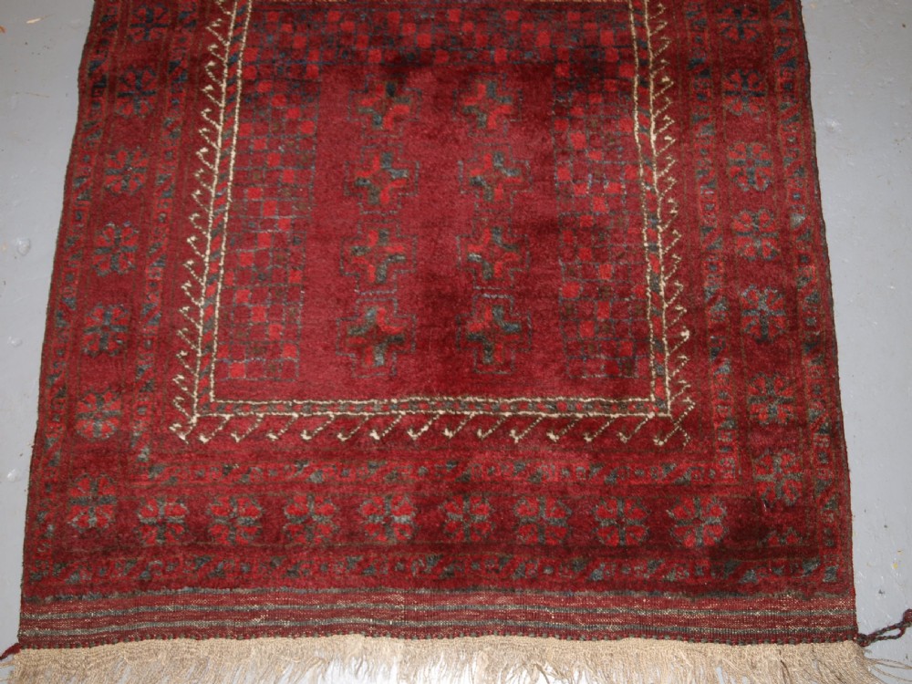 AFGHAN VILLAGE PRAYER RUG WITH RAMS HORN MIHRAB, CIRCA 1920. View IV