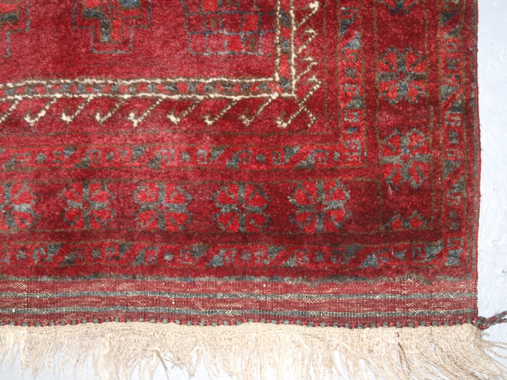 AFGHAN VILLAGE PRAYER RUG WITH RAMS HORN MIHRAB, CIRCA 1920. View IX