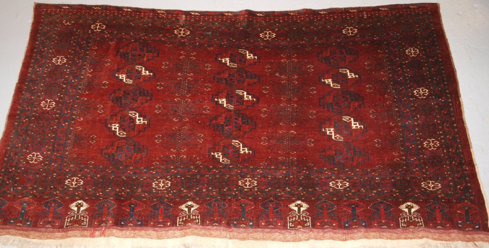 ANTIQUE ERSARI TURKMEN CHUVAL WITH 15 GULS AND GOOD TREE ELEM DESIGN, CIRCA 1900.
