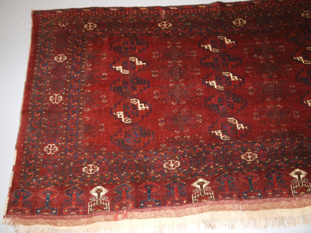 ANTIQUE ERSARI TURKMEN CHUVAL WITH 15 GULS AND GOOD TREE ELEM DESIGN, CIRCA 1900. View II