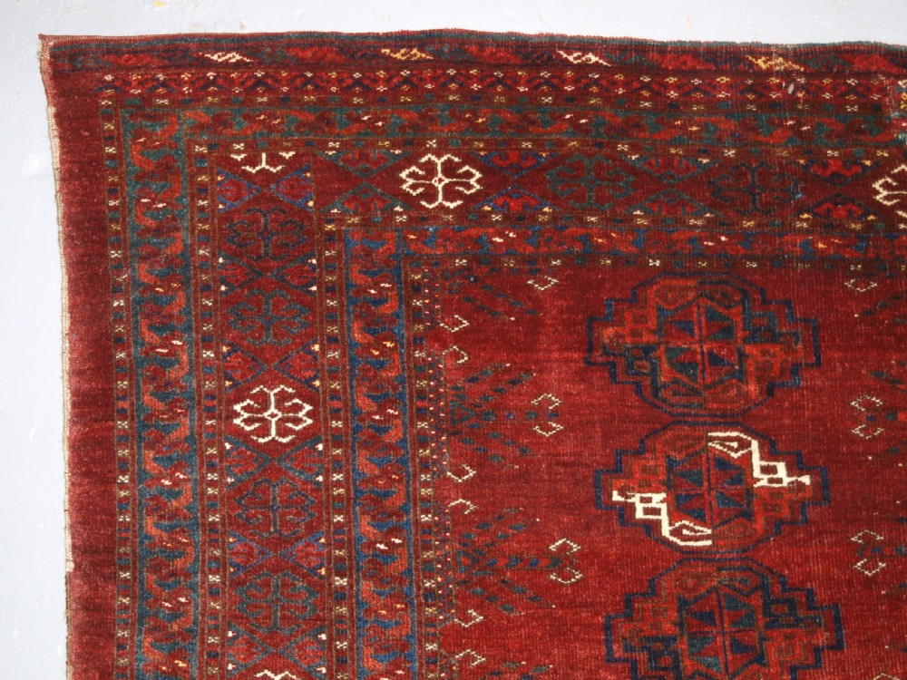 ANTIQUE ERSARI TURKMEN CHUVAL WITH 15 GULS AND GOOD TREE ELEM DESIGN, CIRCA 1900. View V