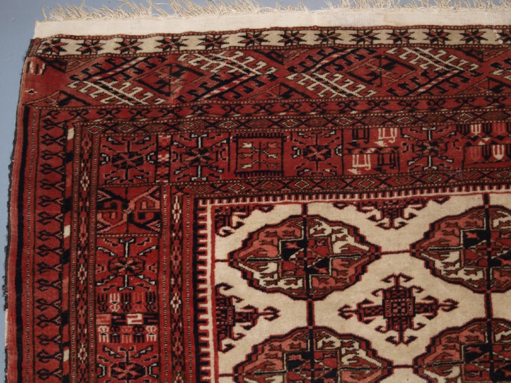 OLD AFGHAN TURKMEN RUG WITH TEKKE DESIGN ON A SCARCE IVORY GROUND. CIRCA 1920. View VI