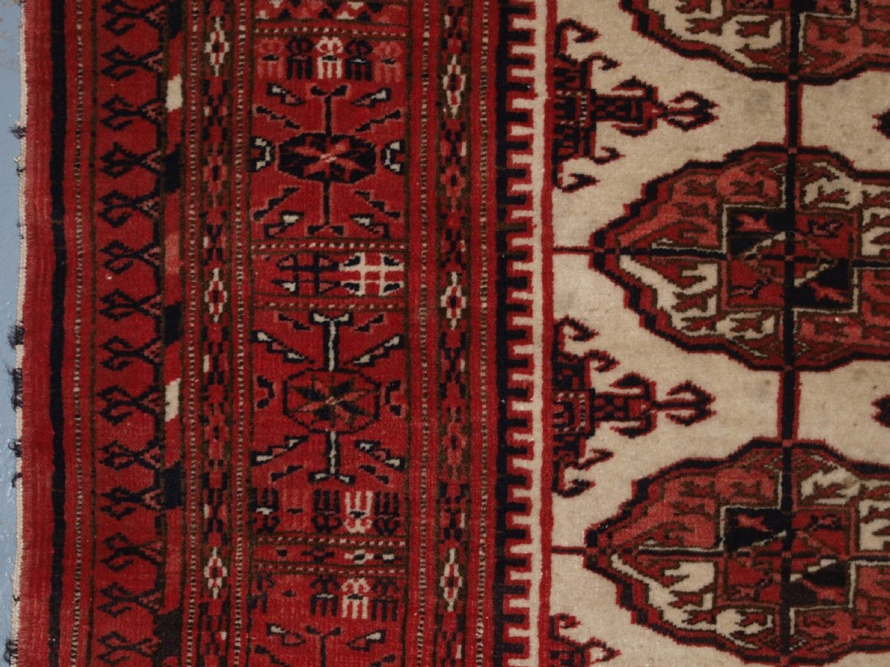 OLD AFGHAN TURKMEN RUG WITH TEKKE DESIGN ON A SCARCE IVORY GROUND. CIRCA 1920. View VII