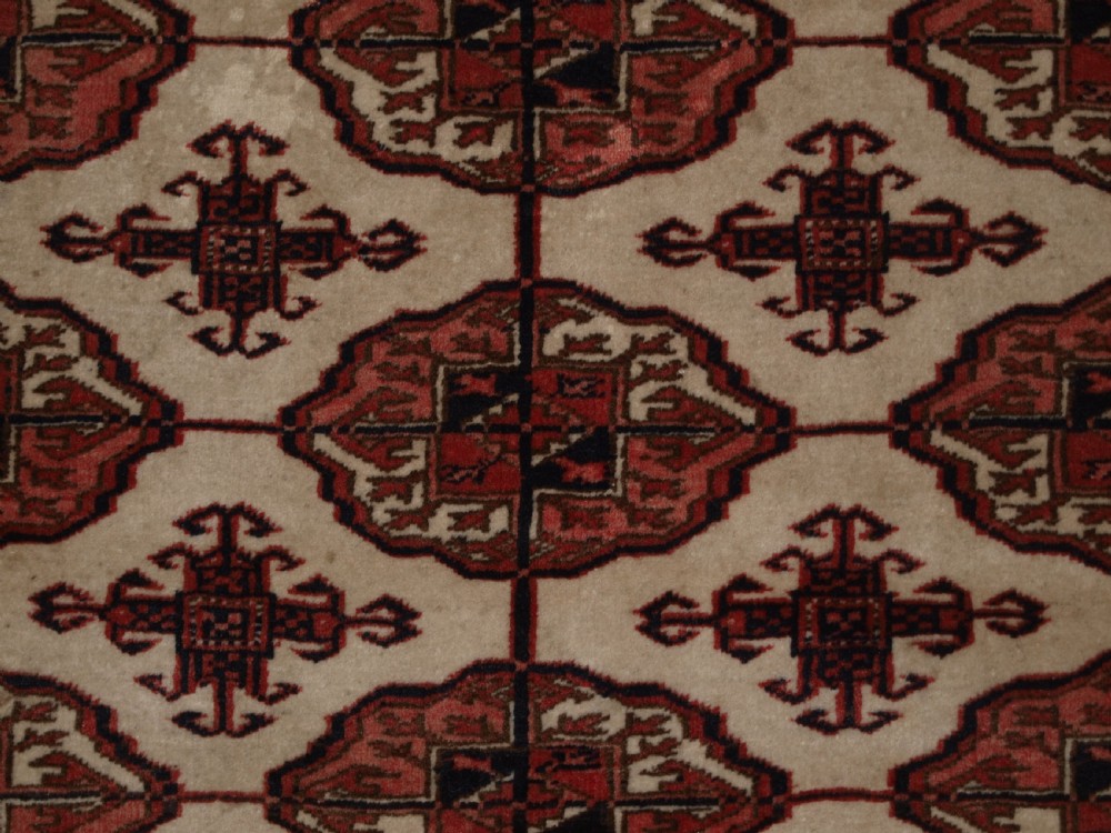 OLD AFGHAN TURKMEN RUG WITH TEKKE DESIGN ON A SCARCE IVORY GROUND. CIRCA 1920. View VIII