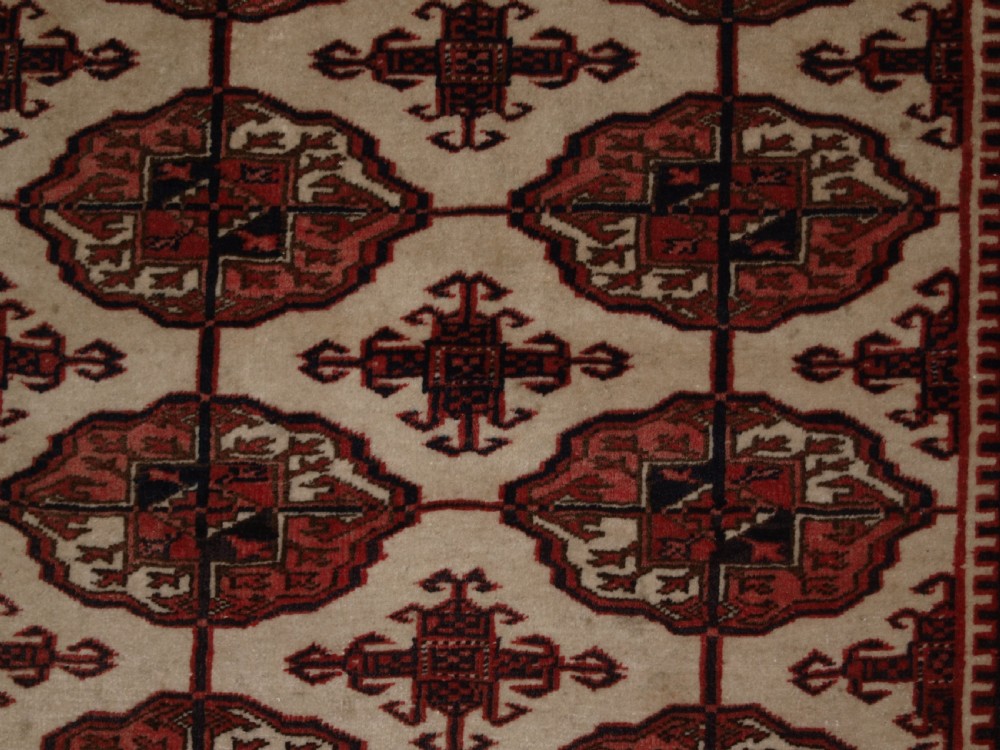 OLD AFGHAN TURKMEN RUG WITH TEKKE DESIGN ON A SCARCE IVORY GROUND. CIRCA 1920. View IX
