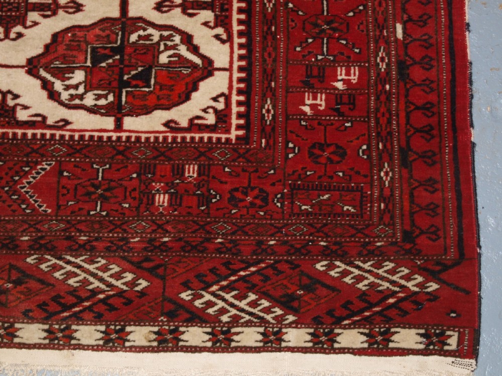 OLD AFGHAN TURKMEN RUG WITH TEKKE DESIGN ON A SCARCE IVORY GROUND. CIRCA 1920. View XI