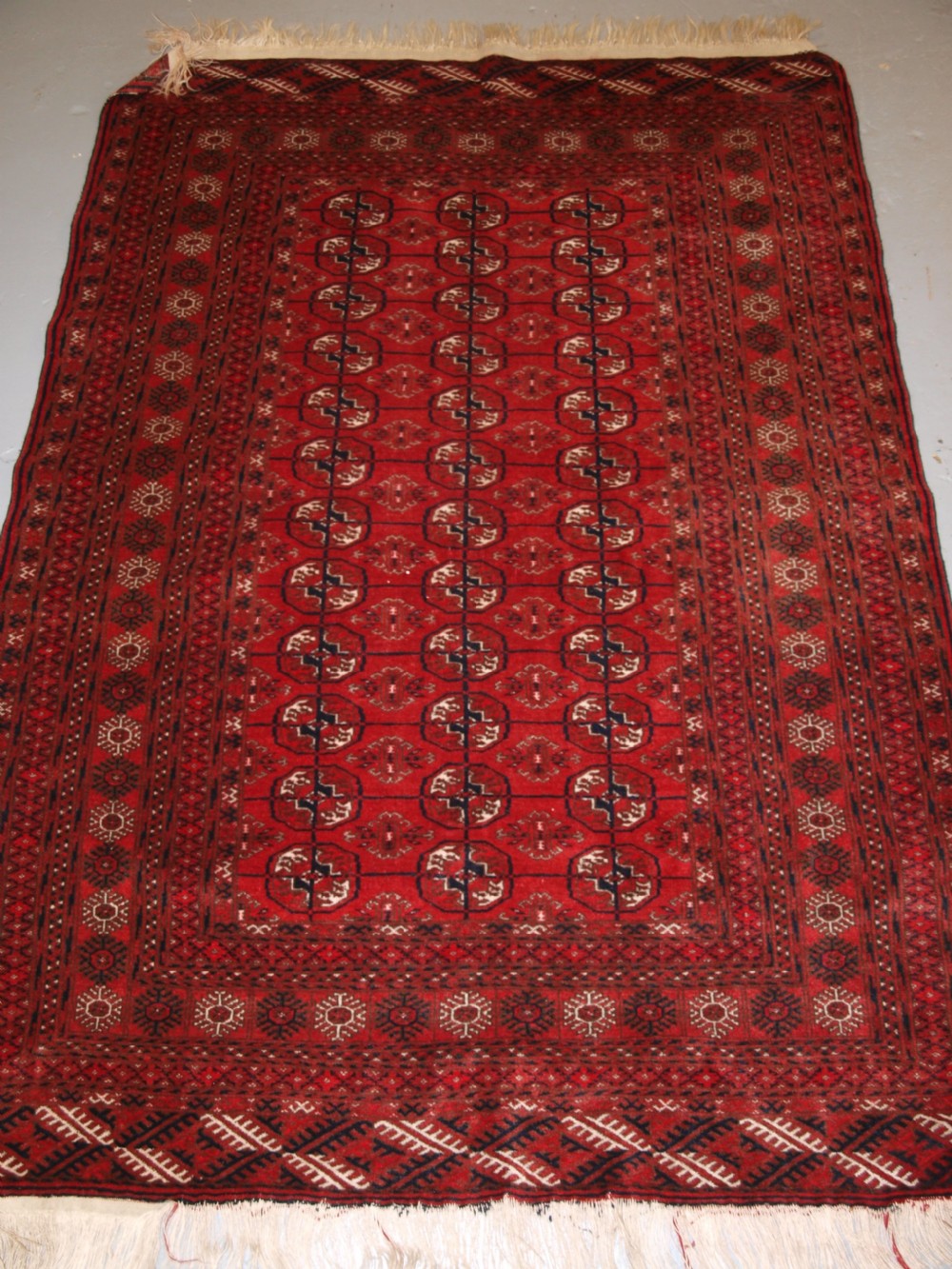 OLD AFGHAN VILLAGE RUG, VERY FINE WEAVE, TEKKE TURKMEN DESIGN, CIRCA 1920.
