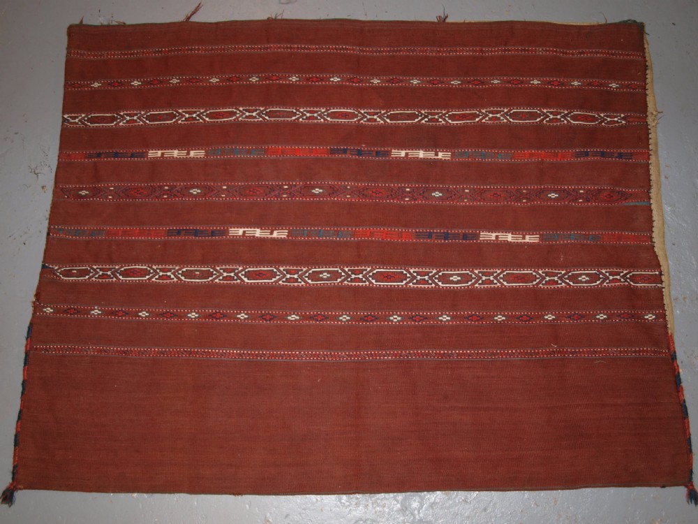 ANTIQUE TEKKE TURKMEN BANDED FLAT WOVEN CHUVAL, COMPLETE WITH BACK, CIRCA 1900.