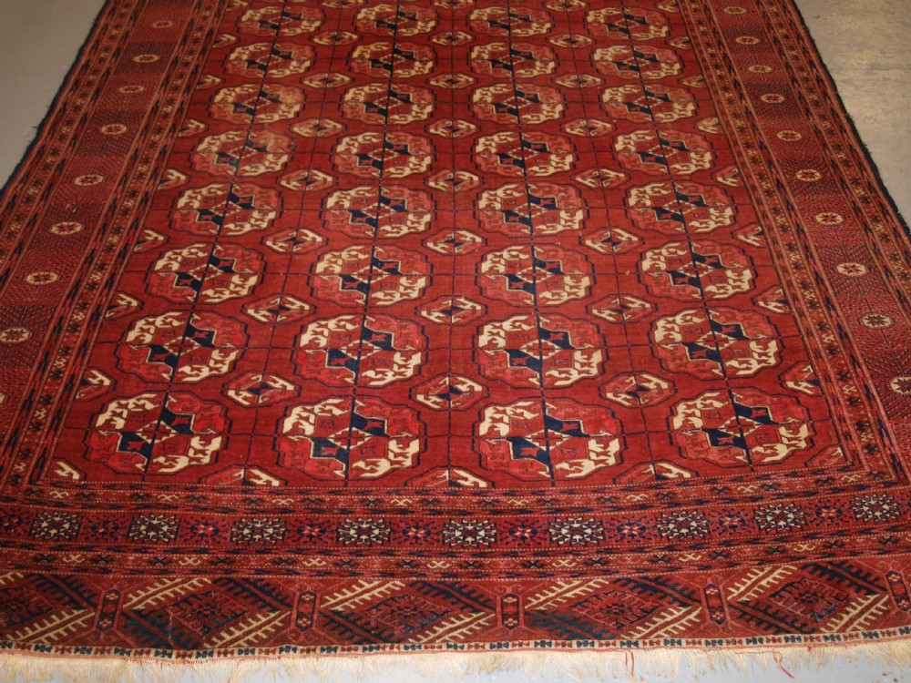 ANTIQUE TEKKE TURKMEN MAIN CARPET, GOOD COLOUR, INTERESTING GULS, LATE 19TH CENTURY. View IV