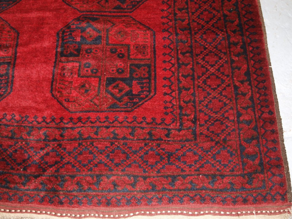 OLD TRADITIONAL RED AFGHAN VILLAGE CARPET, PERFECT CONDITION, CIRCA 1920. View X