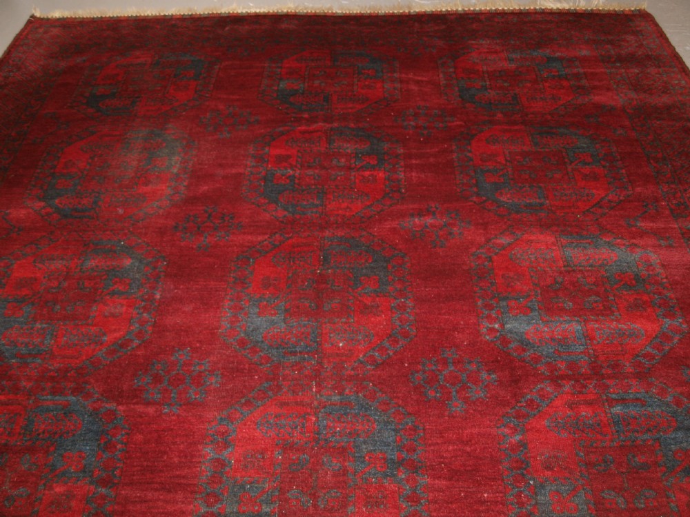 ANTIQUE AFGHAN ERSARI TURKMEN CARPET, DEEP PLUM RED COLOUR, CIRCA 1900. View II
