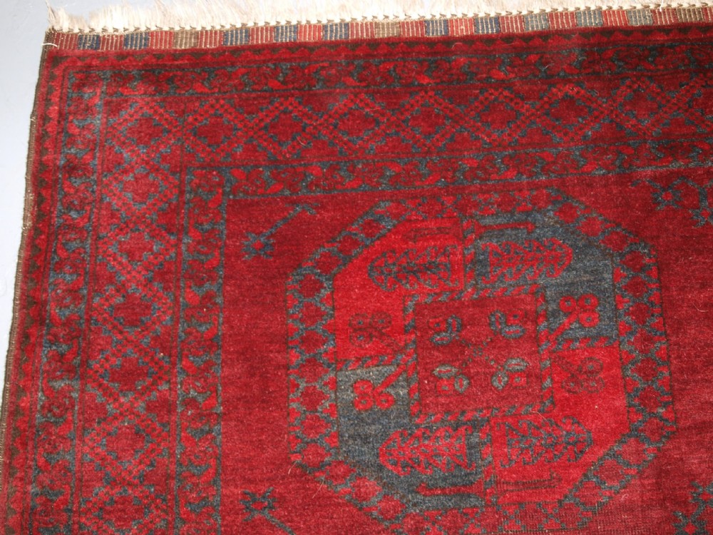 ANTIQUE AFGHAN ERSARI TURKMEN CARPET, DEEP PLUM RED COLOUR, CIRCA 1900. View V