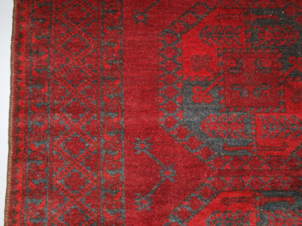 ANTIQUE AFGHAN ERSARI TURKMEN CARPET, DEEP PLUM RED COLOUR, CIRCA 1900. View VI