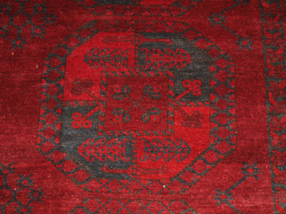 ANTIQUE AFGHAN ERSARI TURKMEN CARPET, DEEP PLUM RED COLOUR, CIRCA 1900. View X