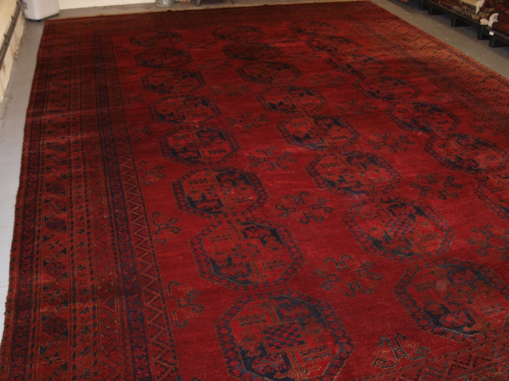 ANTIQUE AFGHAN ERSARI CARPET OF VERY LARGE SIZE WITH SUPERB ROSE MADDER COLOUR, CIRCA 1900. View XVII