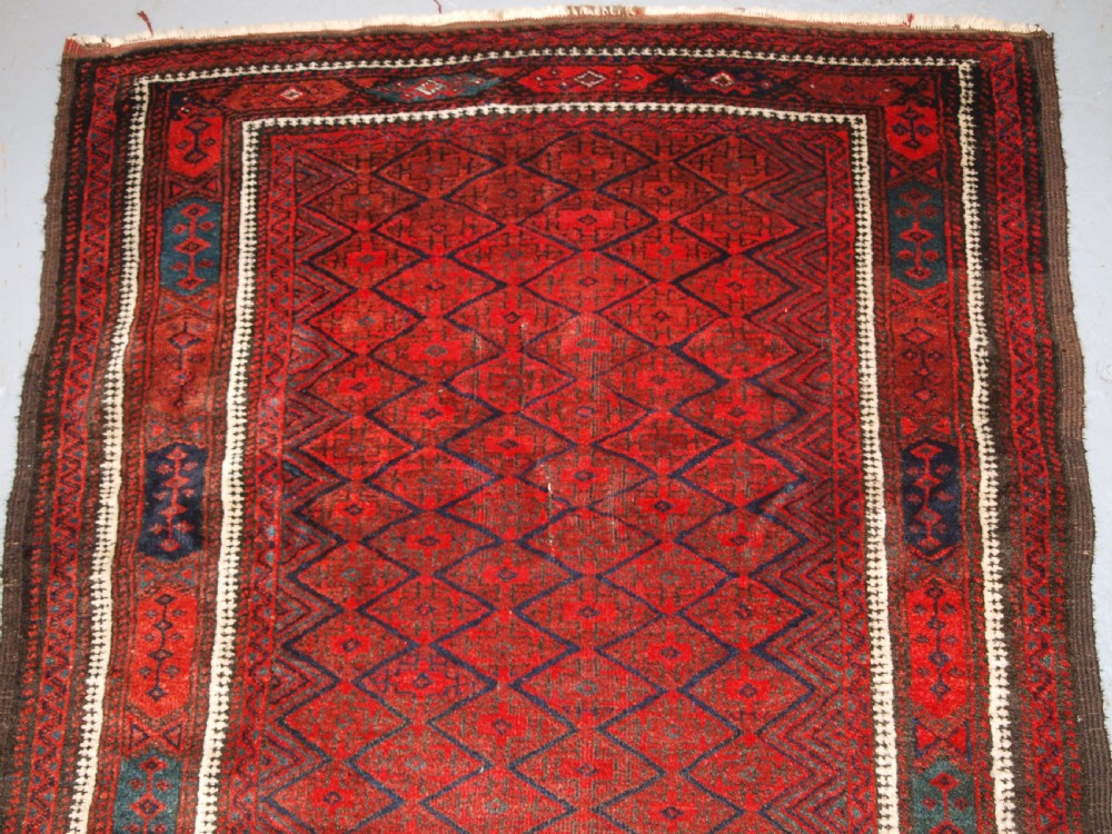 ANTIQUE BALUCH RUG WITH FINE DIAMOND LATTICE DESIGN, INTERESTING BORDER, CIRCA 1900. View V