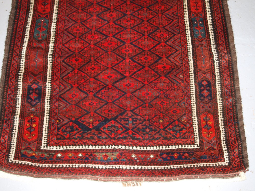 ANTIQUE BALUCH RUG WITH FINE DIAMOND LATTICE DESIGN, INTERESTING BORDER, CIRCA 1900. View VII