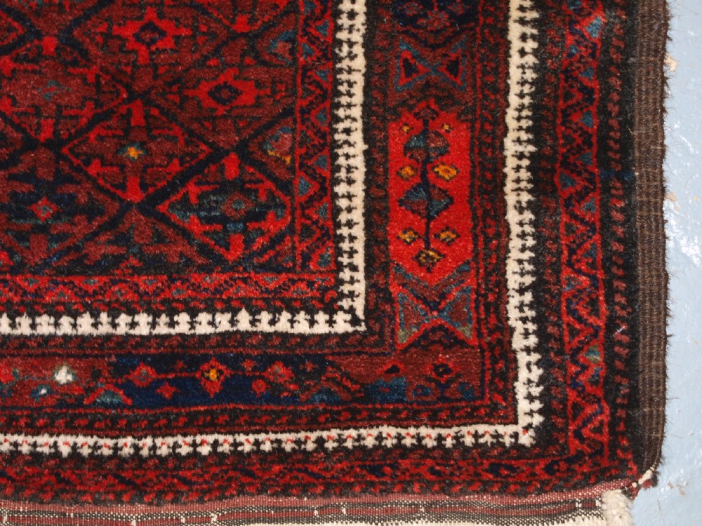 ANTIQUE BALUCH RUG WITH FINE DIAMOND LATTICE DESIGN, INTERESTING BORDER, CIRCA 1900. View XI