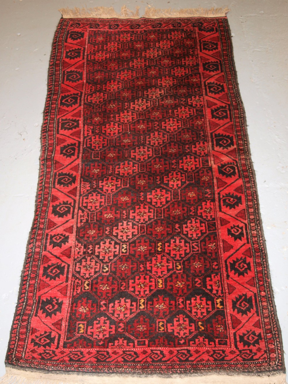 OLD AFGHAN RUG WITH REPEAT DESIGN, CURL LEAF BORDER, RUSTIC CHARM, CIRCA 1920.
