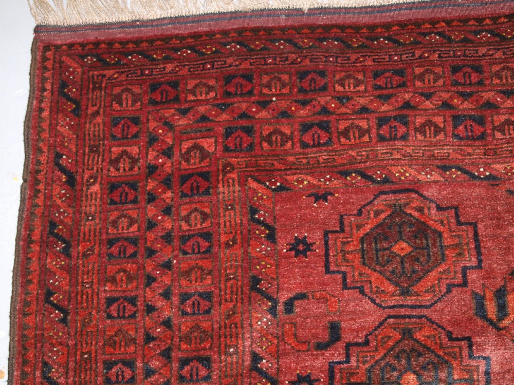 OLD AFGHAN VILLAGE RUG WITH TURKMEN CHUVAL GUL DESIGN, PLUM RED COLOUR, CIRCA 1920. View III