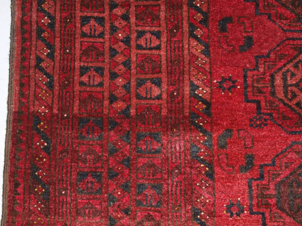 OLD AFGHAN VILLAGE RUG WITH TURKMEN CHUVAL GUL DESIGN, PLUM RED COLOUR, CIRCA 1920. View IV