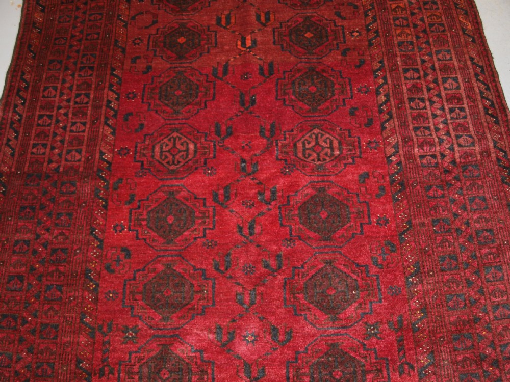 OLD AFGHAN VILLAGE RUG WITH TURKMEN CHUVAL GUL DESIGN, PLUM RED COLOUR, CIRCA 1920. View VI